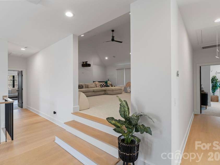 20320 Havenview Drive, Cornelius, NC 28031.  MLS# CAR4342352, YatesRealty ID 9251. Upper Media/Rec room features built-ins, cozy carpeting, projector, wall-screen & automated blackout blinds for movie nights.
