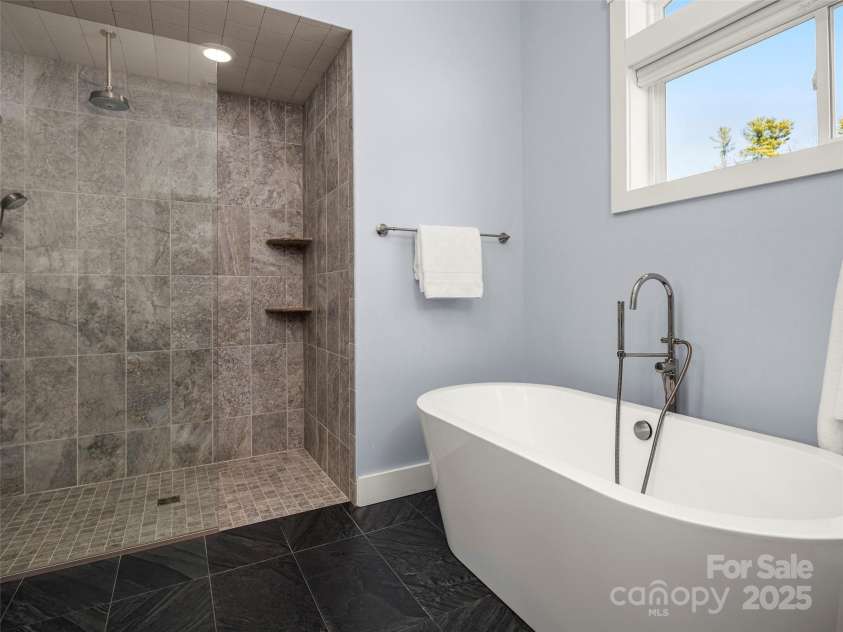 14 Al Dorf Drive, Weaverville, NC 28787.  MLS# CAR4238293, YatesRealty ID 9254. Custom tile walk-in shower and large soaking bathtub.