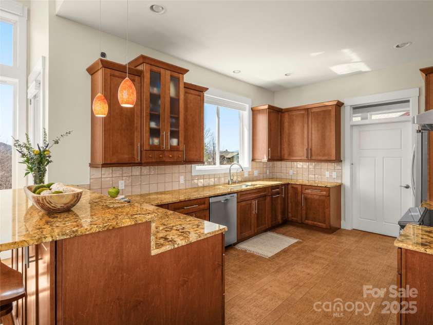 14 Al Dorf Drive, Weaverville, NC 28787.  MLS# CAR4238293, YatesRealty ID 9254. Plenty of storage, custom cabinetry built with pull-out drawers.