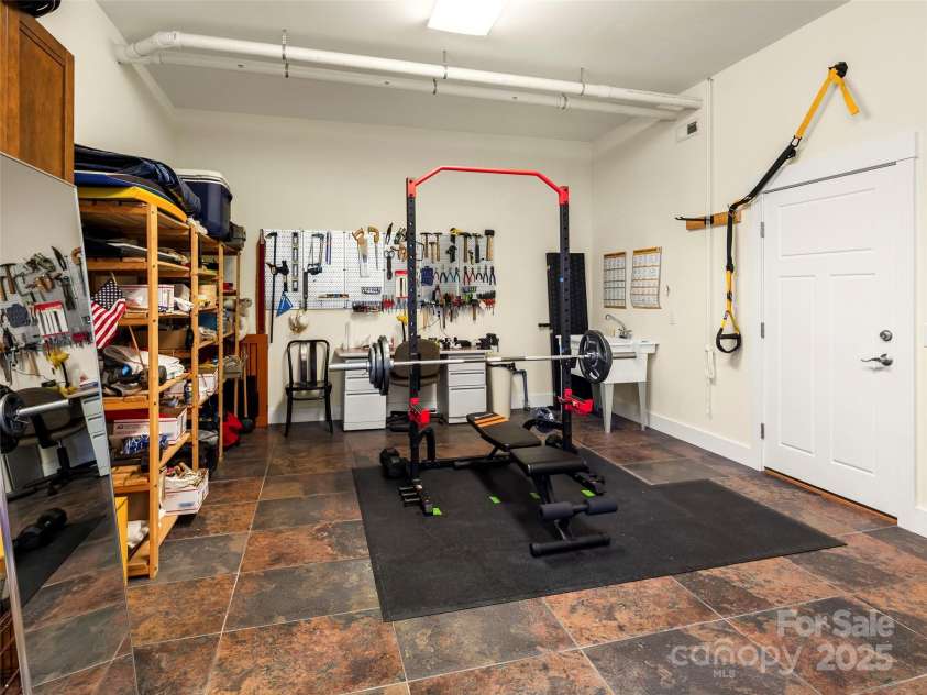 14 Al Dorf Drive, Weaverville, NC 28787.  MLS# CAR4238293, YatesRealty ID 9254. Workshop room on terrace level allows for use of whatever your hobby might be.