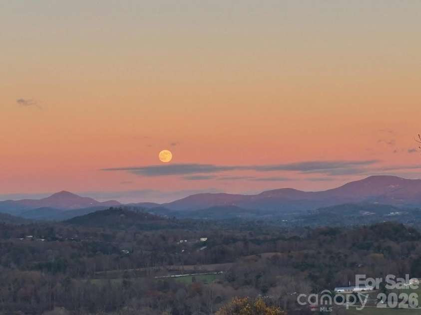 98 Rock Cliff Way, Hendersonville, NC 28791.  MLS# CAR4363363, YatesRealty ID 9260. Moonrise at sunset