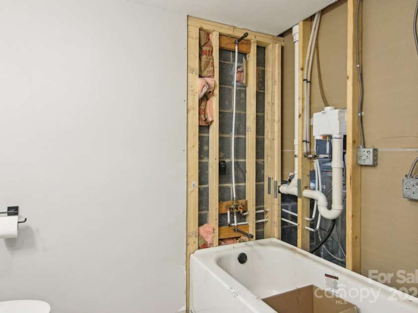 403 Crest Road, East Flat Rock, NC 28726.  MLS# CAR4230629, YatesRealty ID 9266. Unfinished Bathroom in Garage