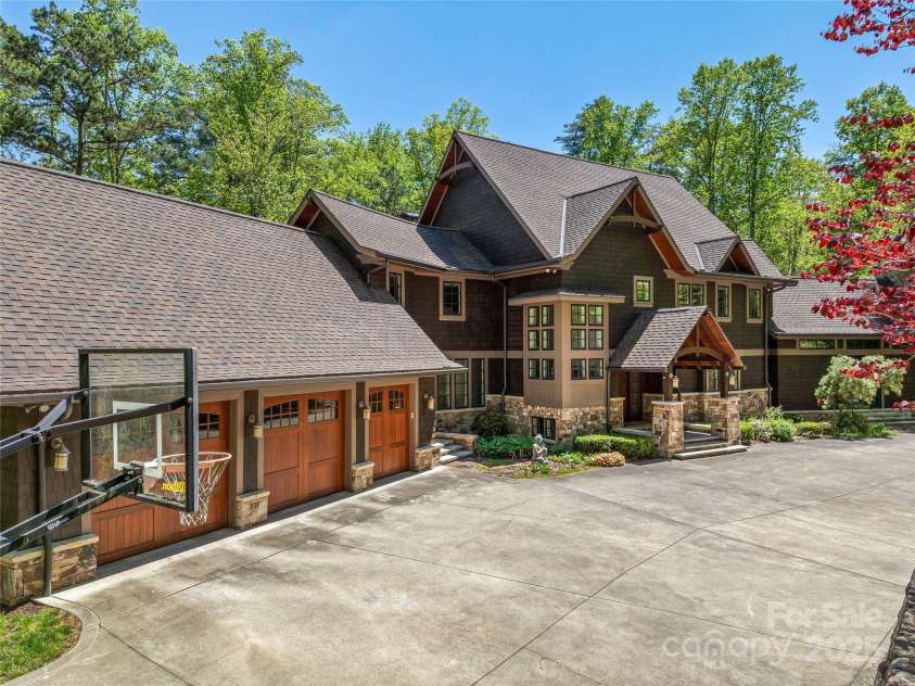 51 Robinhood Road, Asheville, NC 28804.  MLS# CAR4203746, YatesRealty ID 927. 3 Car Garage and a  large flat auto court greets you upon entering.