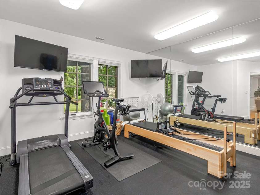 51 Robinhood Road, Asheville, NC 28804.  MLS# CAR4203746, YatesRealty ID 927. Exercise room with mirrored wall