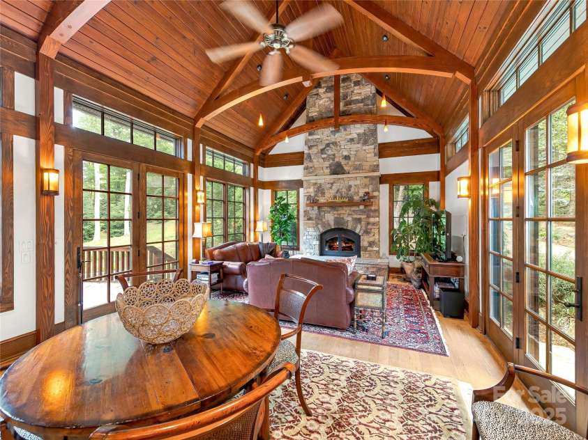 51 Robinhood Road, Asheville, NC 28804.  MLS# CAR4203746, YatesRealty ID 927. Incredible Family Room with TN stone and Xtrordinair Fireplace, Douglas Fir ceiling, Structural Insulated Panels (SIPS) roofing, and tons of natural light.  Access to front motor court of back deck.