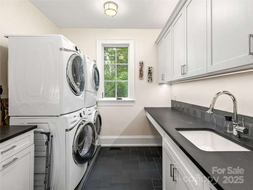 51 Robinhood Road, Asheville, NC 28804.  MLS# CAR4203746, YatesRealty ID 927. Laundry room with double washer/dryers