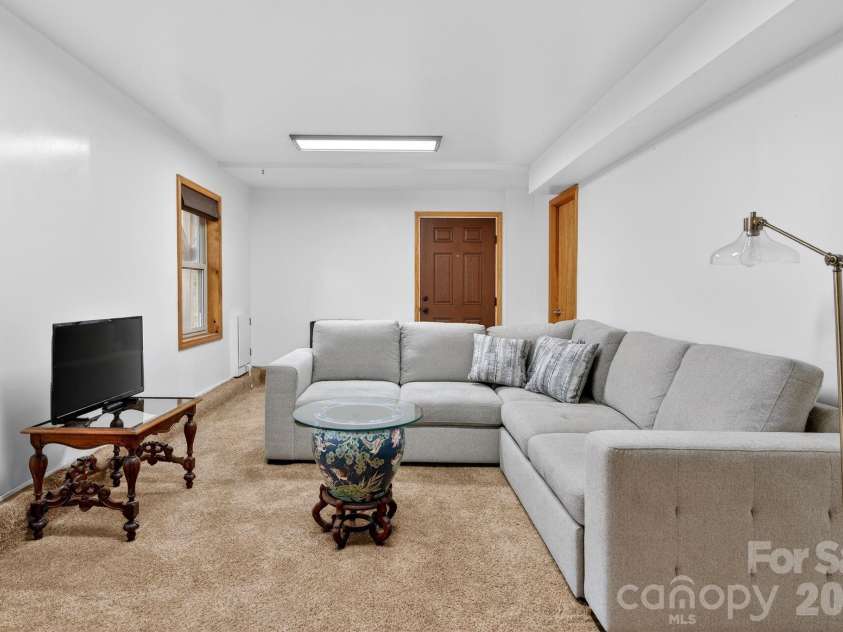 63 Independence Boulevard, Asheville, NC 28805.  MLS# CAR4347392, YatesRealty ID 9270. Downstairs den
