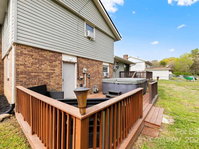 1308 Gaston Way, Dallas, NC 28034.  MLS# CAR4240422, YatesRealty ID 9272. Back door from lower level laundry area and hot tub