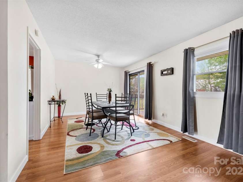 1308 Gaston Way, Dallas, NC 28034.  MLS# CAR4240422, YatesRealty ID 9272. Large dining area with sliding doors to deck in back