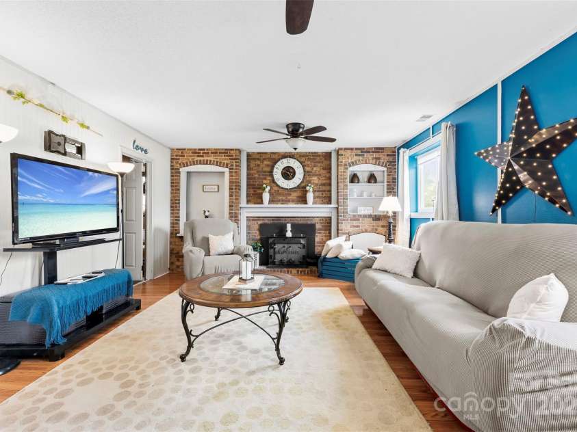 1308 Gaston Way, Dallas, NC 28034.  MLS# CAR4240422, YatesRealty ID 9272. Lower level family room with fireplace
