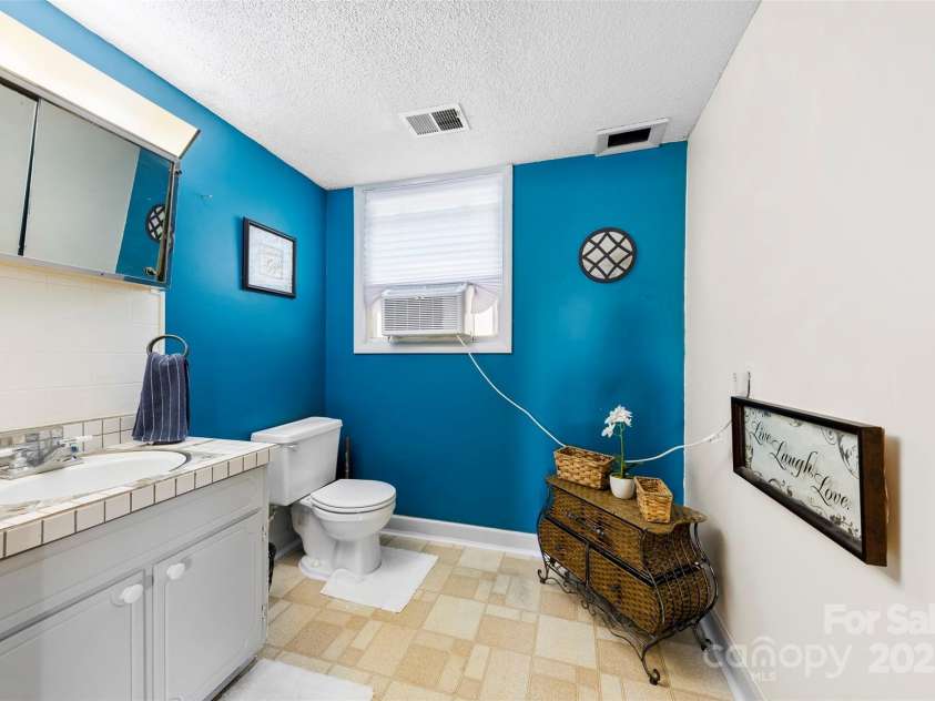 1308 Gaston Way, Dallas, NC 28034.  MLS# CAR4240422, YatesRealty ID 9272. Lower level half bath