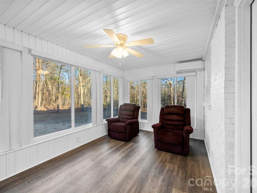 1045 Elizabeth Drive, Dallas, NC 28034.  MLS# CAR4334067, YatesRealty ID 9273. Awesome sunroom loverlooking your private backyard. Sunroom has mini-split system for climate control and all windows open for the fresh spring breeze. 