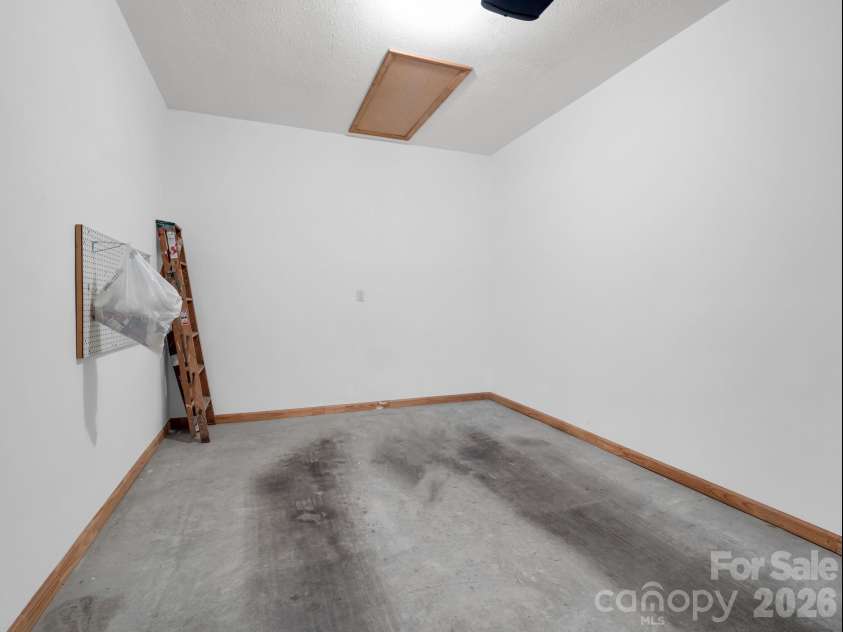 25 Coldwater Lane, Laurel Park, NC 28739.  MLS# CAR4350806, YatesRealty ID 9283. One car garage with added storage above