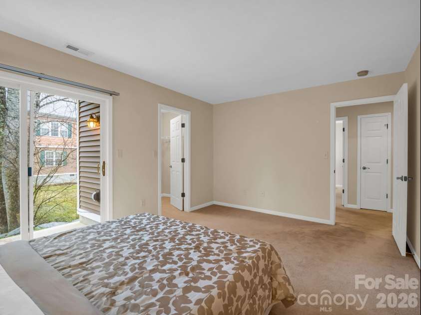 25 Coldwater Lane, Laurel Park, NC 28739.  MLS# CAR4350806, YatesRealty ID 9283. Second Bedroom with access to lower patio
