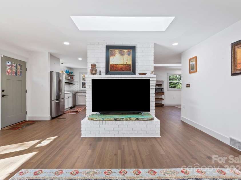 2149 Williamson Creek Road, Pisgah Forest, NC 28768.  MLS# CAR4318546, YatesRealty ID 9284. Cozy fireplace