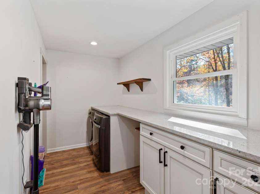 2149 Williamson Creek Road, Pisgah Forest, NC 28768.  MLS# CAR4318546, YatesRealty ID 9284. Huge, custom laundry room on main level
