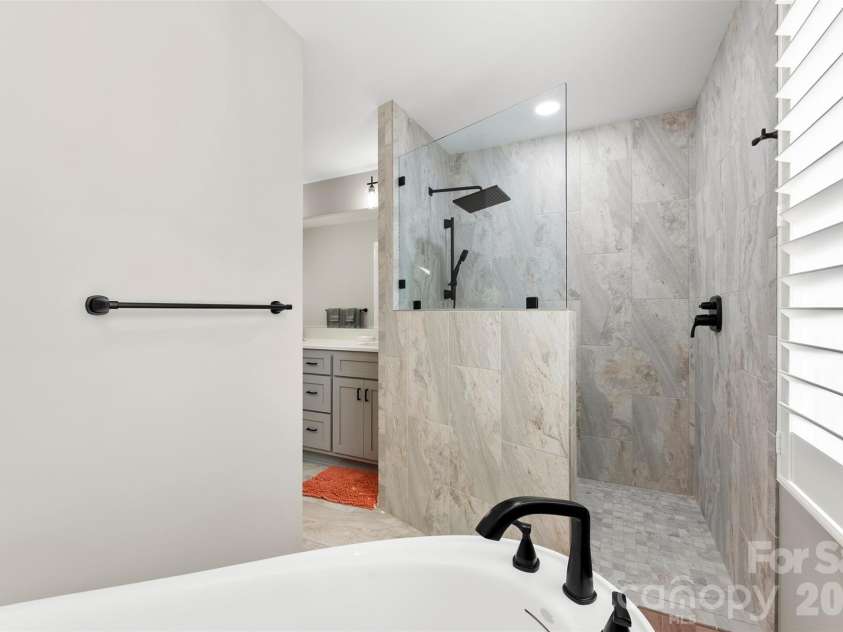 4242 John Ritchie Road, Iron Station, NC 28080.  MLS# CAR4350188, YatesRealty ID 9296. 2025 Primary Bathroom