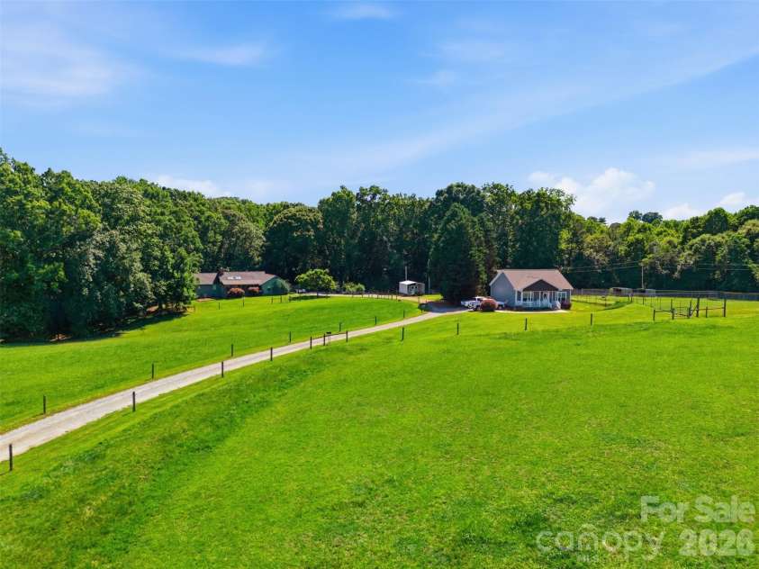 4242 John Ritchie Road, Iron Station, NC 28080.  MLS# CAR4350188, YatesRealty ID 9296. 22.2 Acres Fully Fenced In