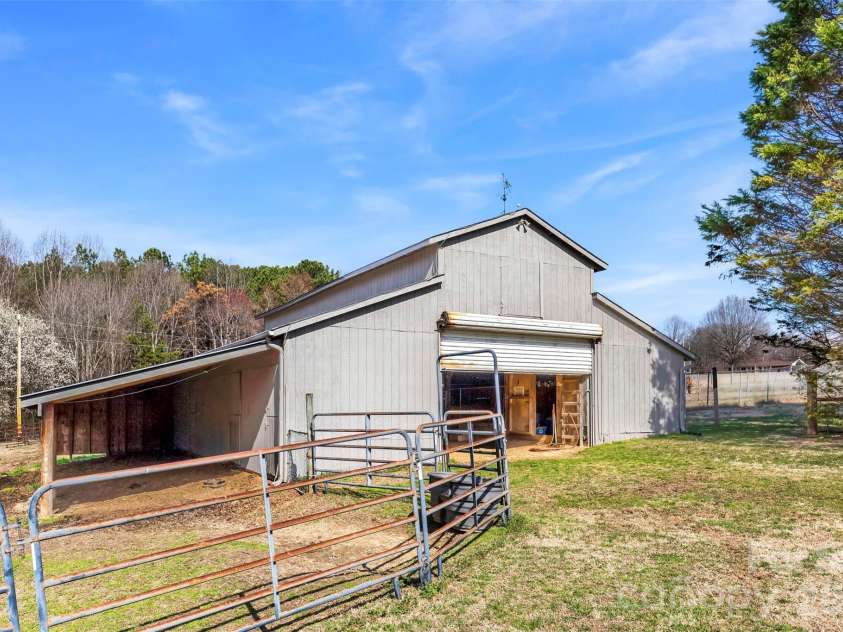 4242 John Ritchie Road, Iron Station, NC 28080.  MLS# CAR4350188, YatesRealty ID 9296. 7-Stable Barn + Lean to