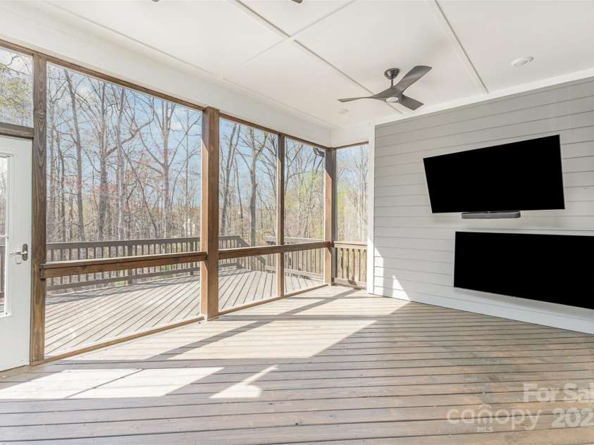 123 Farm Knoll Way, Mooresville, NC 28117.  MLS# CAR4239025, YatesRealty ID 9297. Screen Porch with 2 TVs just off the living room on main living level