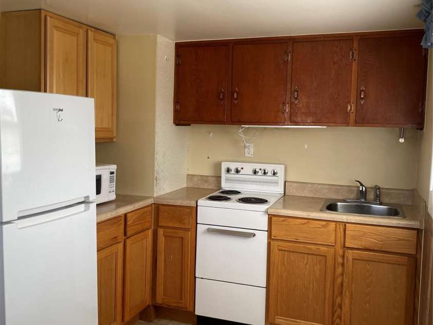 565 Neely Road, Brevard, NC 28712.  MLS# CAR4074647, YatesRealty ID 9297. Apartment 1 kitchen