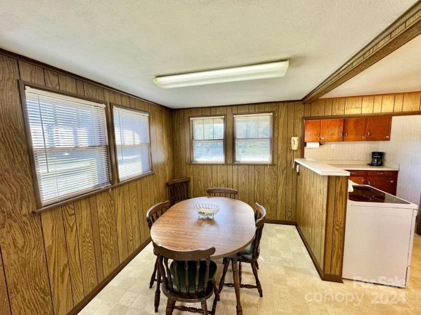 565 Neely Road, Brevard, NC 28712.  MLS# CAR4074647, YatesRealty ID 9297. Main Home Breakfast Room