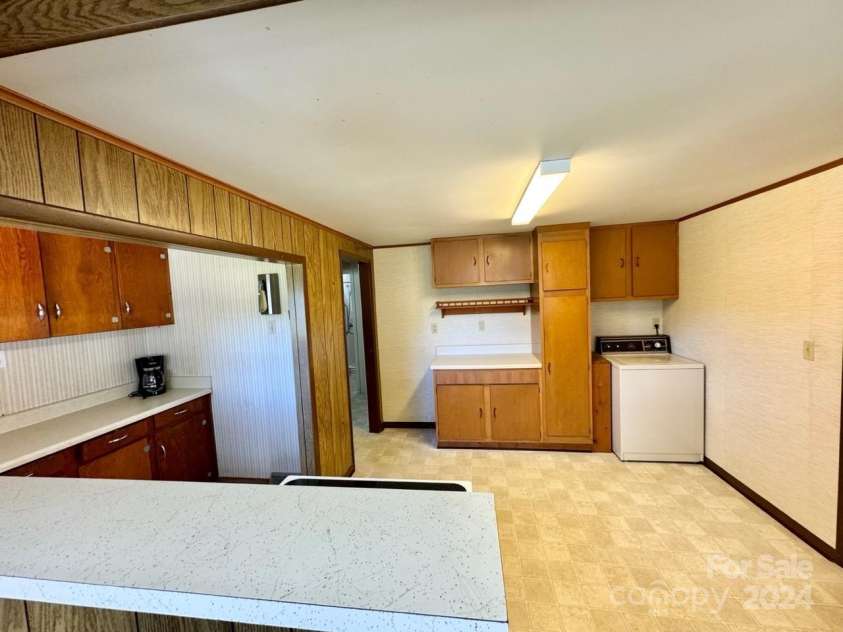 565 Neely Road, Brevard, NC 28712.  MLS# CAR4074647, YatesRealty ID 9297. Main Home Kitchen #2