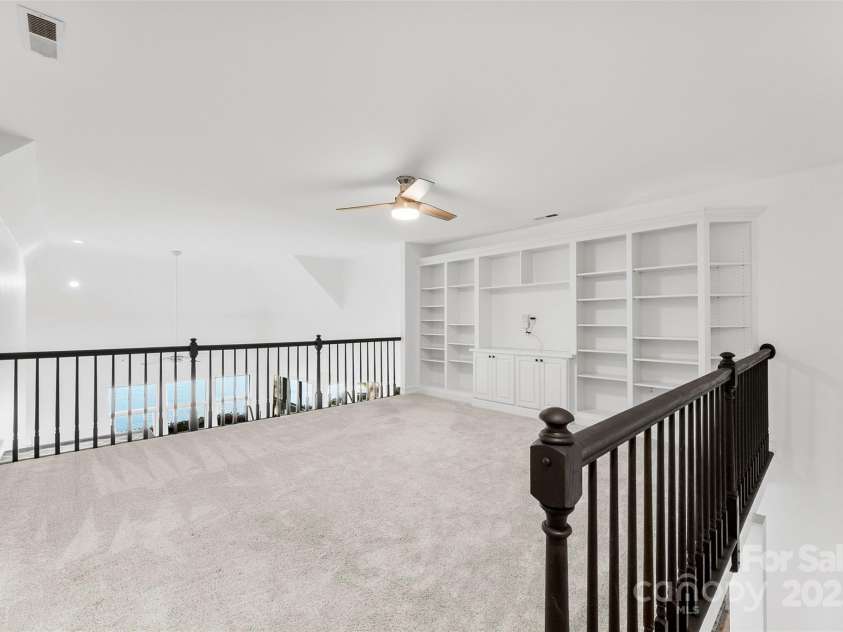 15838 Pineknoll Lane, Huntersville, NC 28078.  MLS# CAR4251643, YatesRealty ID 9298. Upstairs loft with build ins
