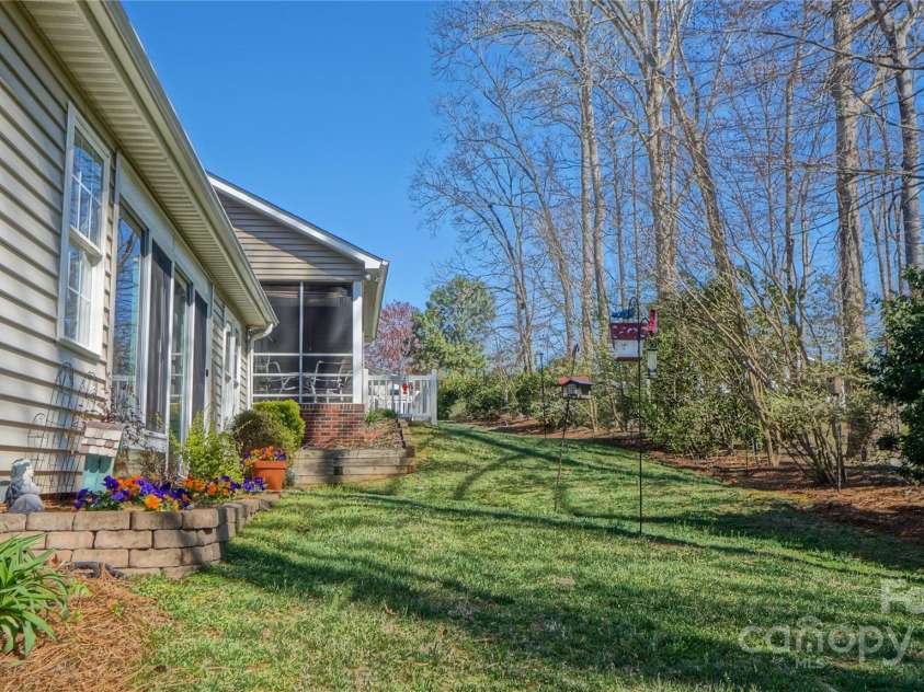115 Keswick Lane, Mooresville, NC 28117.  MLS# CAR4245086, YatesRealty ID 9299. Backyard - watch for the deer, bunnies, and lots of birds!