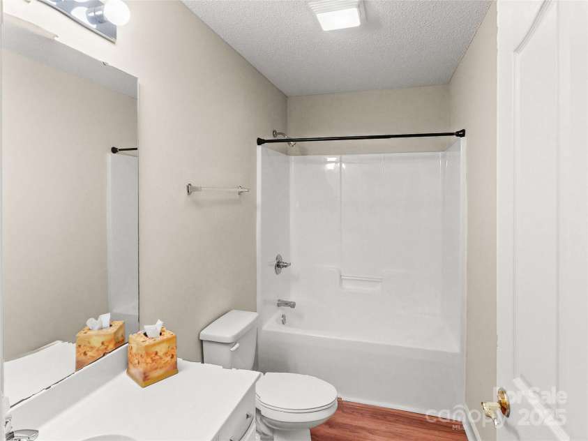 115 Keswick Lane, Mooresville, NC 28117.  MLS# CAR4245086, YatesRealty ID 9299. Guest Bath has new vinyl plank flooring!