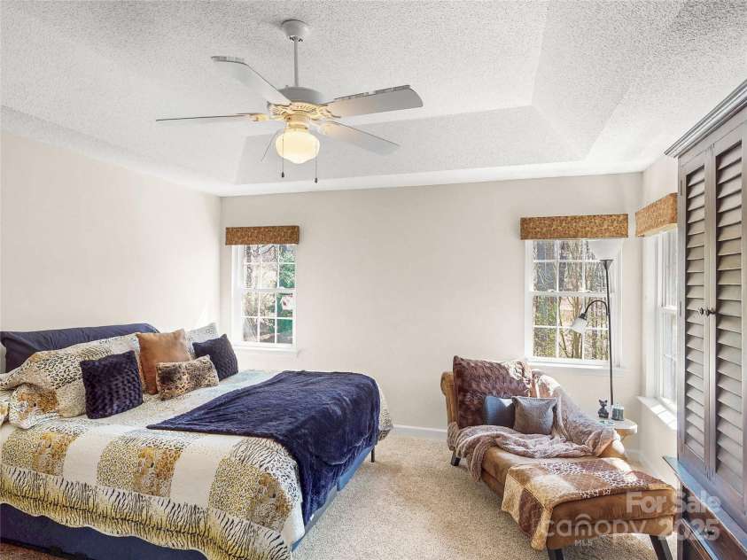 115 Keswick Lane, Mooresville, NC 28117.  MLS# CAR4245086, YatesRealty ID 9299. Primary Bedroom with 3 windows to watch for wildlife!