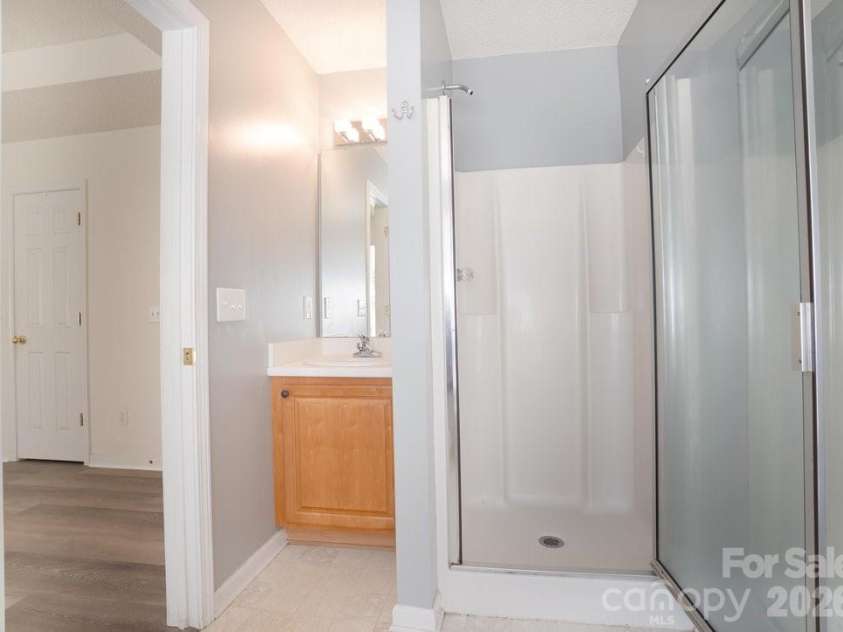 122 Addison Place, Troutman, NC 28166.  MLS# CAR4363617, YatesRealty ID 9299. Primary Bathroom
