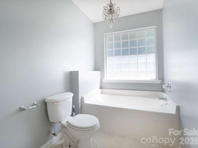 122 Addison Place, Troutman, NC 28166.  MLS# CAR4363617, YatesRealty ID 9299. Primary Bathroom