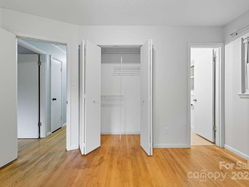51 Campground Road, Asheville, NC 28805.  MLS# CAR4274929, YatesRealty ID 9303. Primary closet has wire shelving/closet organizer system