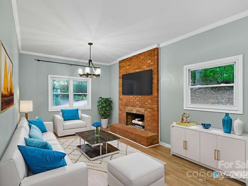 51 Campground Road, Asheville, NC 28805.  MLS# CAR4274929, YatesRealty ID 9303. Virtually staged step down second living room with propane gas logs