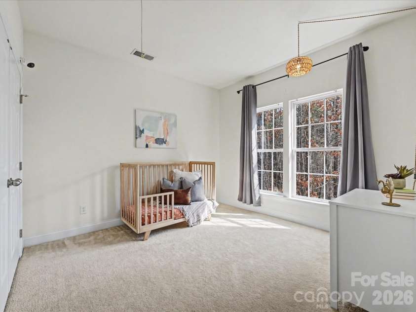 108 Braxton Gate Court, Mount Holly, NC 28120.  MLS# CAR4351876, YatesRealty ID 9308. Comfortable third bedroom featuring large windows, soft natural light, and ample space for a variety of uses.