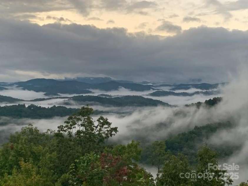 85 Ridge Road, Rosman, NC 28772.  MLS# CAR4314913, YatesRealty ID 9317. After the Rain