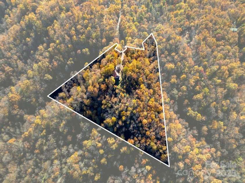 85 Ridge Road, Rosman, NC 28772.  MLS# CAR4314913, YatesRealty ID 9317. Nestled in a 5+ Acre Lot