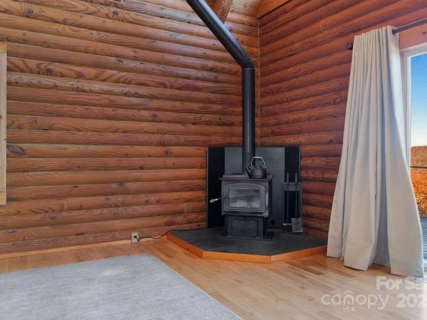 85 Ridge Road, Rosman, NC 28772.  MLS# CAR4314913, YatesRealty ID 9317. Wood Stove