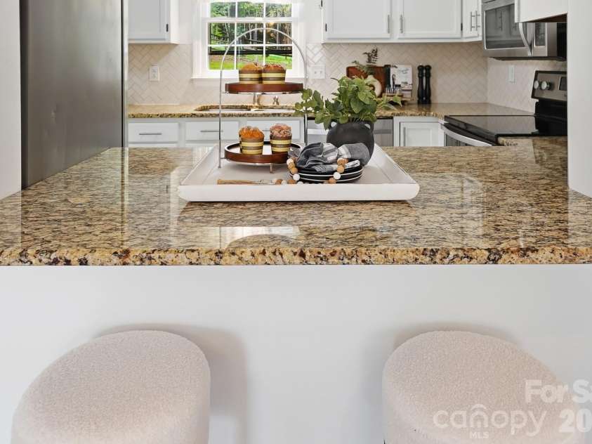 8912 Danson Drive, Charlotte, NC 28277.  MLS# CAR4364378, YatesRealty ID 9321. Open-concept feel with clear sightlines to dining and kitchen areas—perfect for gathering.