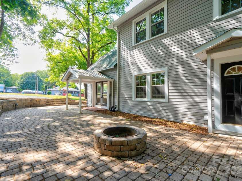 824 Stagecoach Trail, Lawndale, NC 28090.  MLS# CAR4157465, YatesRealty ID 9322. Back Patio Firepit