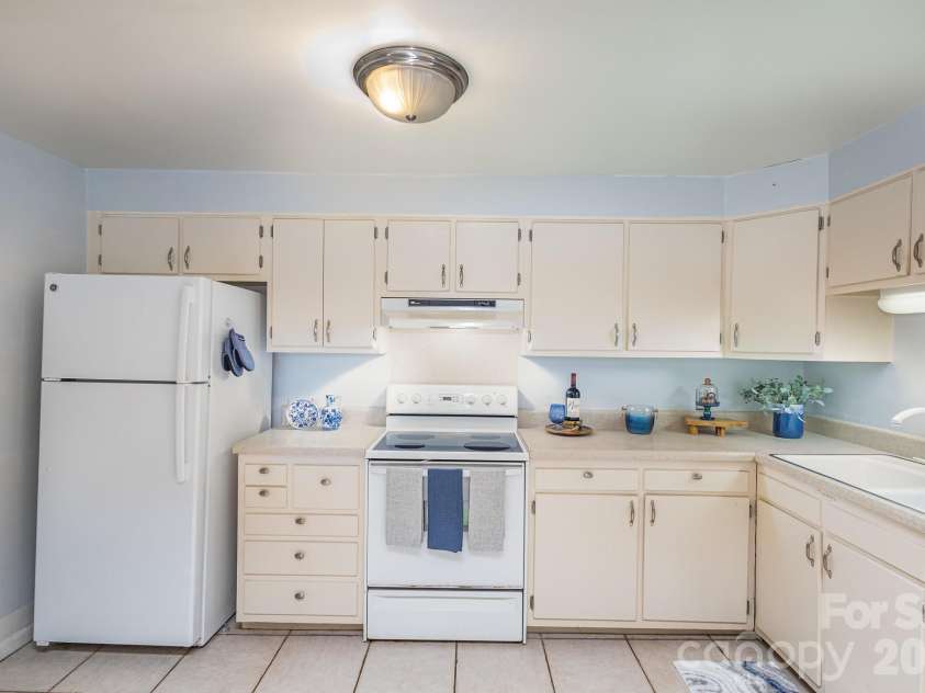 1300 Reece Road, Charlotte, NC 28209.  MLS# CAR4322239, YatesRealty ID 9326. Full kitchen has pantry - staged