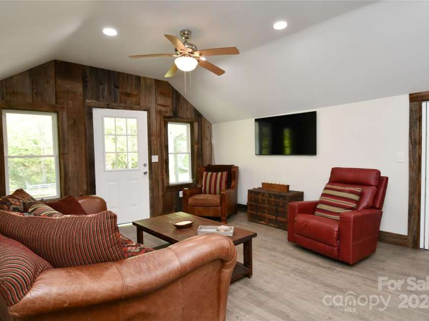 2180 Pigeon Roost Road, Green Mountain, NC 28740.  MLS# CAR4137054, YatesRealty ID 9333. Another angle on the living room