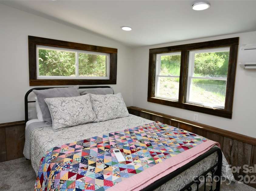2180 Pigeon Roost Road, Green Mountain, NC 28740.  MLS# CAR4137054, YatesRealty ID 9333. Master bedroom, airy and light