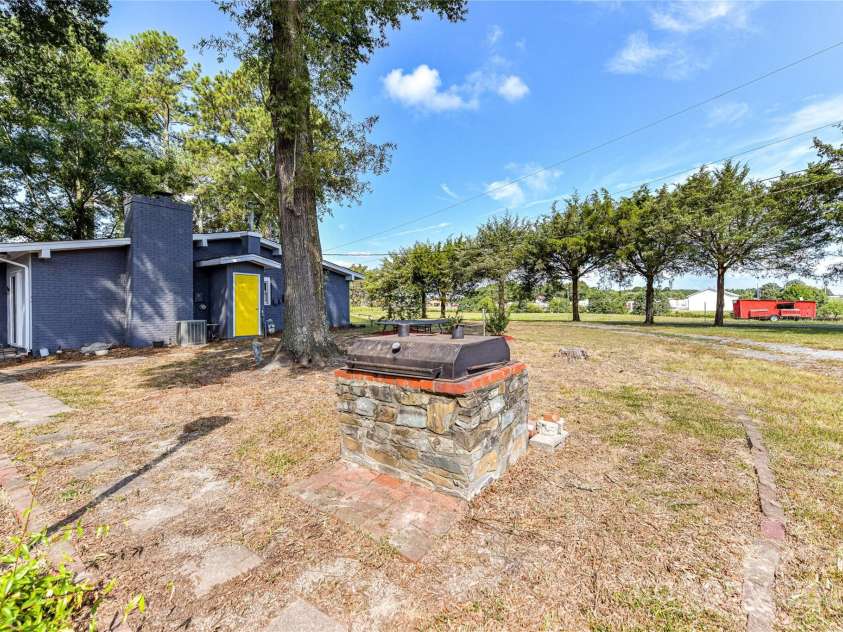 1021 Cyrus Edwards Road, Monroe, NC 28110.  MLS# CAR4314591, YatesRealty ID 9336. Rear view/backyard grilling station