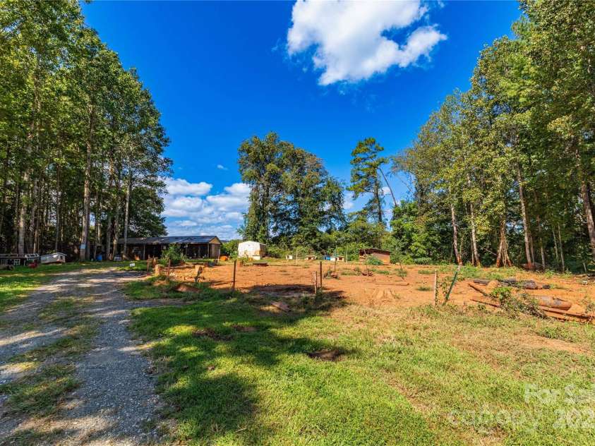 653 Mag Sluder Road, Alexander, NC 28701.  MLS# CAR4299475, YatesRealty ID 934. Back portion of the property with a fenced dog lot 