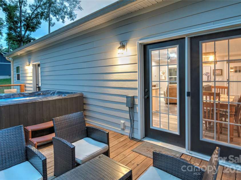 122 Cascade Ridge Road, Fairview, NC 28730.  MLS# CAR4227423, YatesRealty ID 9343. Back deck with hot tub great for entertaining