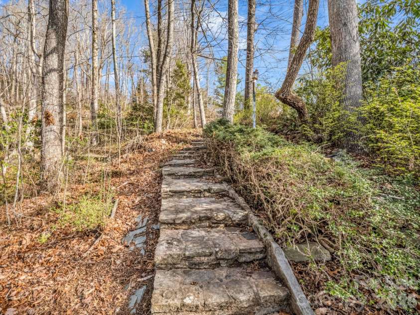 755 Mount Olivet Road, Zirconia, NC 28790.  MLS# CAR4336609, YatesRealty ID 9345. Stone steps to back yard