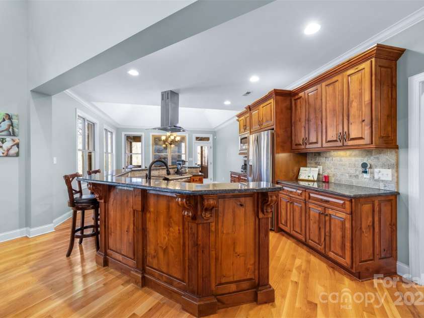 404 Yorkfield Drive, Shelby, NC 28150.  MLS# CAR4205572, YatesRealty ID 9353. Adjacent to the kitchen the hallway will lead you to a large pantry, kitchen accessory storage closet, office/craft room, half bath, huge laundry room, stairs up to the F.R.O.G, side home entrance and two car attached gara