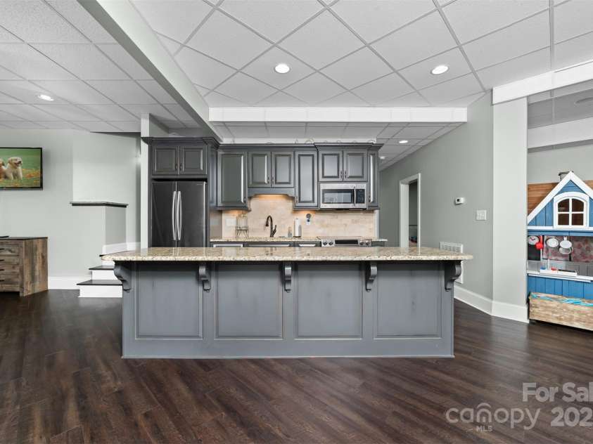 404 Yorkfield Drive, Shelby, NC 28150.  MLS# CAR4205572, YatesRealty ID 9353. Basement Kitchen is flanked by two den areas.